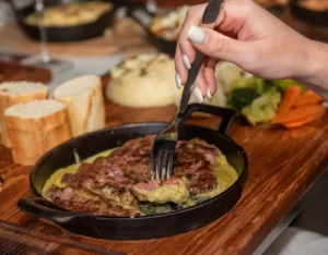 Steak served with signature sauce at Memories L’Entrecôte’s Restaurant Rooftop