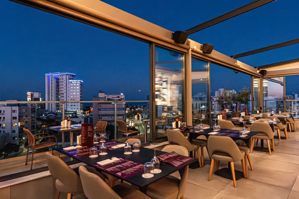 Evening view of Memories Rooftop Restaurant terrace and dining area in Larnaca